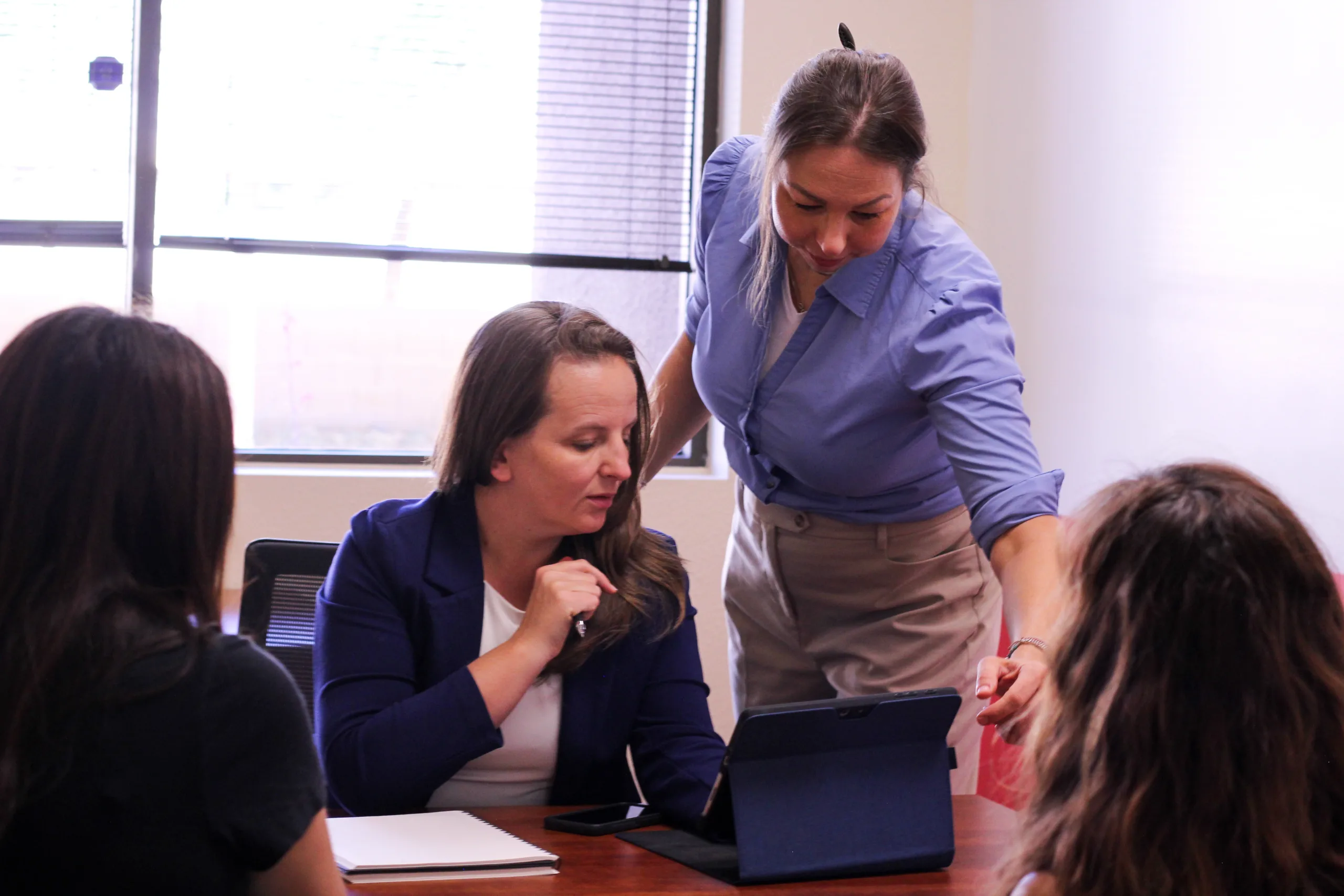 A founder and an operations advisor interviewing a candidate during a hiring round